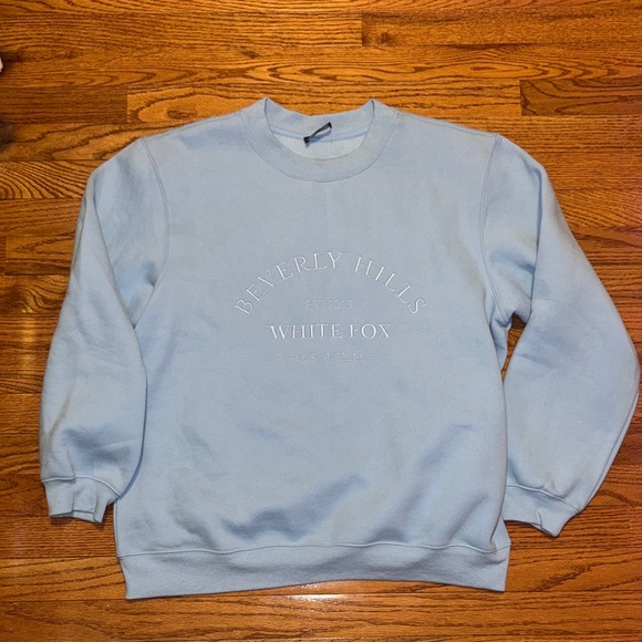 White Fox Boutique Tops - White Fox baby blue sweatshirt